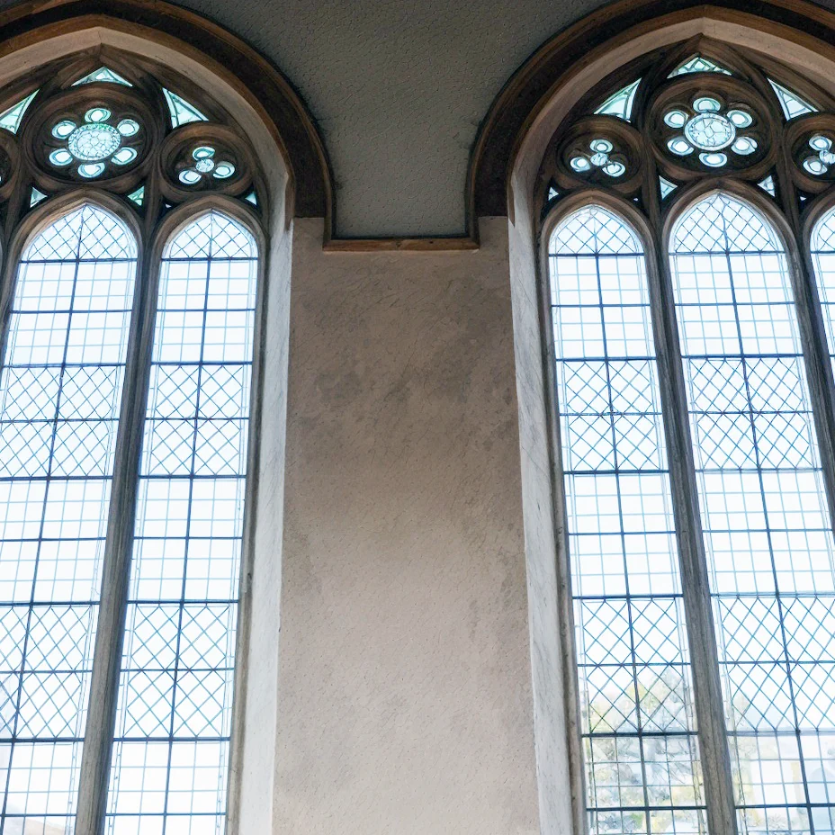 Interior of St John’s Church Coleford showing nave, chancel, stained glass windows and historic altar